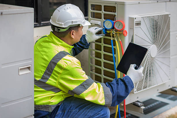 Professional Air Conditioning Repair technician working in Grafton, ND